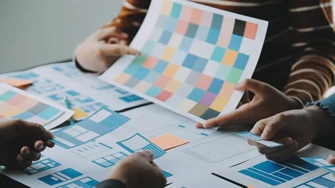 Close up ux developer and ui designer brainstorming about mobile app interf.. Stock Footage 236854181