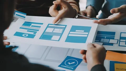 Close up ux developer and ui designer brainstorming about mobile app interf.. Stock Footage 236854184