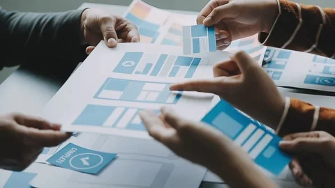 Close up ux developer and ui designer brainstorming about mobile app interf.. Stock Footage 236854185