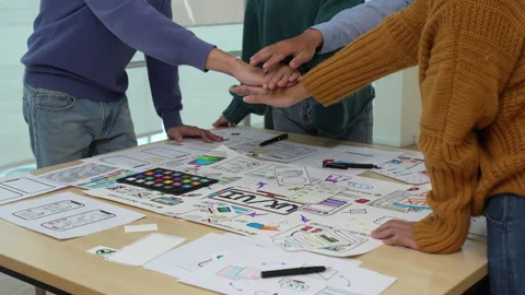 Close up ux developer and ui designer brainstorming interface wireframe design Stock Footage 243426867