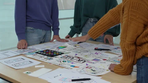 Close up ux developer and ui designer brainstorming interface wireframe design Stock Footage 243976775