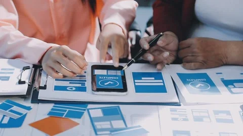 Close up ux developer and ui designer brainstorming about mobile app interf.. Stock Footage 293923270