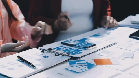 Close up ux developer and ui designer brainstorming about mobile app interf.. Stock Footage 293923279