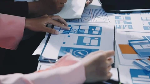 Close up ux developer and ui designer brainstorming about mobile app interf.. Stock Footage 293923323