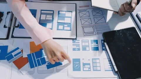 Close up ux developer and ui designer brainstorming about mobile app interf.. Stock Footage 293923327