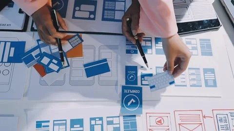 Close up ux developer and ui designer brainstorming about mobile app interf.. Stock Footage 293923343