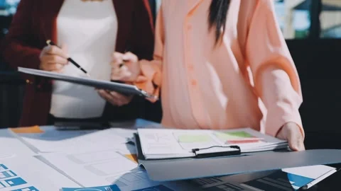 Close up ux developer and ui designer brainstorming about mobile app interf.. Stock Footage 293923389