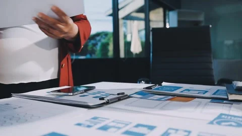 Close up ux developer and ui designer brainstorming about mobile app interf.. Stock Footage 293923416