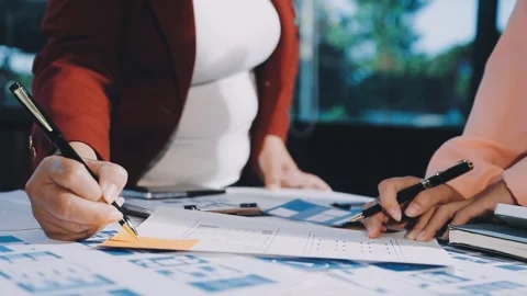 Close up ux developer and ui designer brainstorming about mobile app interf.. Stock Footage 293923419