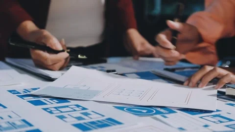 Close up ux developer and ui designer brainstorming about mobile app interf.. Stock Footage 293923432
