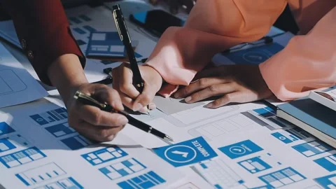 Close up ux developer and ui designer brainstorming about mobile app interf.. Stock Footage 293923439