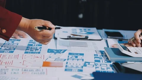 Close up ux developer and ui designer brainstorming about mobile app interf.. Stock Footage 293923445