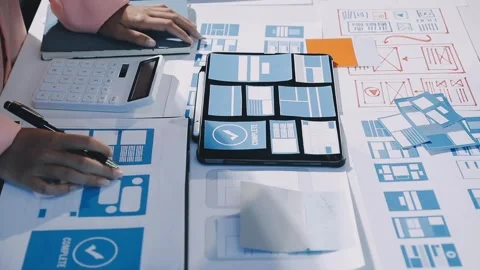 Close up ux developer and ui designer brainstorming about mobile app interf.. Stock Footage 293923486