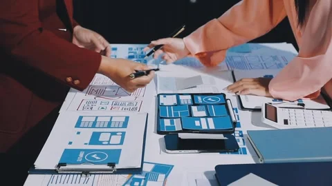 Close up ux developer and ui designer brainstorming about mobile app interf.. Stock Footage 293923492