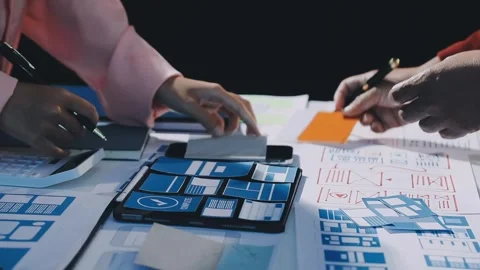 Close up ux developer and ui designer brainstorming about mobile app interf.. Stock Footage 293923493