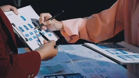 Close up ux developer and ui designer brainstorming about mobile app interf.. Stock Footage 293923501
