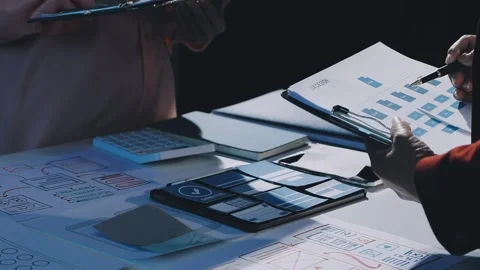 Close up ux developer and ui designer brainstorming about mobile app interf.. Stock Footage 293923503