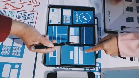 Close up ux developer and ui designer brainstorming about mobile app interf.. Stock Footage 293923534