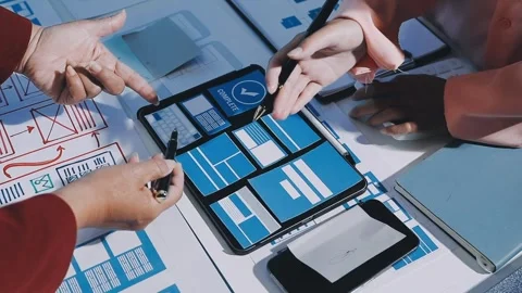 Close up ux developer and ui designer brainstorming about mobile app interf.. Stock Footage 293923537