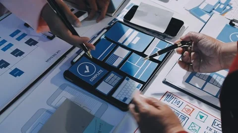Close up ux developer and ui designer brainstorming about mobile app interf.. Stock Footage 293923541