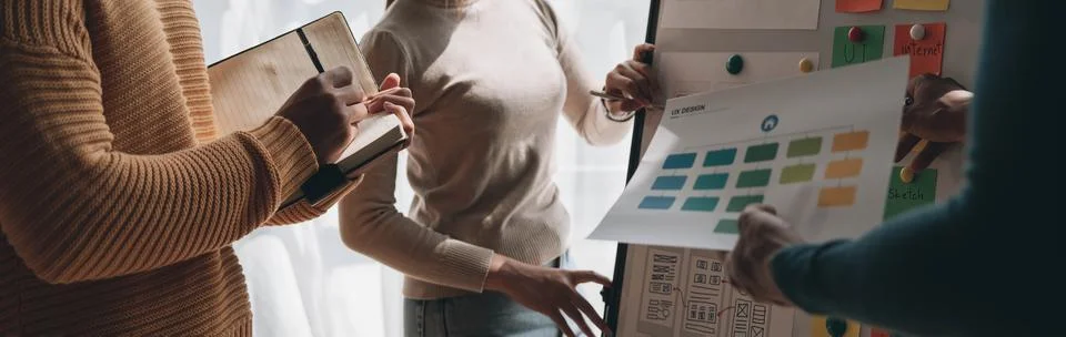 Close up ux developer and ui designer brainstorming about mobile app interface Foto stock