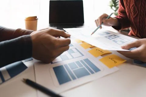 Close up ux developer and ui designer brainstorming about mobile app interface Foto stock