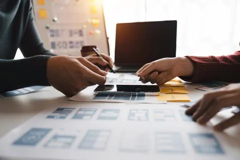 Close up ux developer and ui designer brainstorming about mobile app interface 스톡 사진