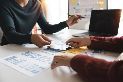 Close up ux developer and ui designer brainstorming about mobile app interface Foto stock