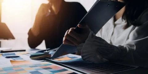 Close up ux developer and ui designer brainstorming about mobile app interf.. Stock Photos