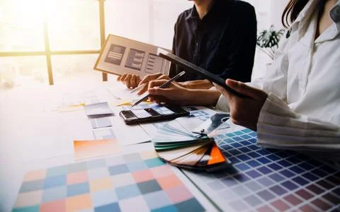 Close up ux developer and ui designer brainstorming about mobile app interf.. Stock Photos