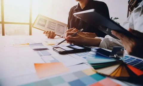 Close up ux developer and ui designer brainstorming about mobile app interf.. Stock Photos