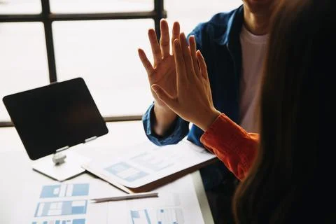 Close up ux developer and ui designer brainstorming about mobile app interf.. Stock Photos