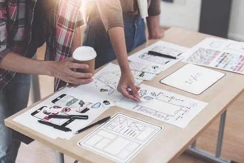 Close up ux developer and ui designer brainstorming interface wireframe design Foto stock