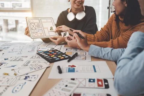 Close up ux developer and ui designer brainstorming interface wireframe design Foto stock