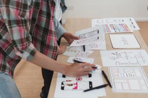 Close up ux developer and ui designer brainstorming interface wireframe design 写真素材