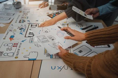 Close up ux developer and ui designer brainstorming interface wireframe design Foto stock