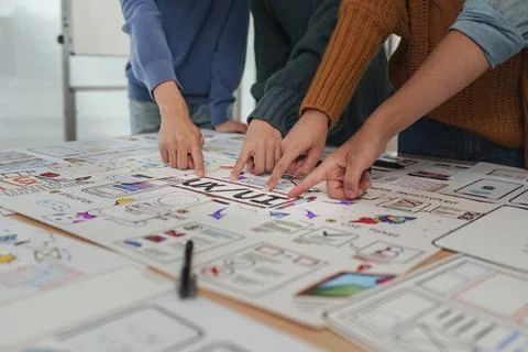 Close up ux developer and ui designer brainstorming interface wireframe design Stock Photos