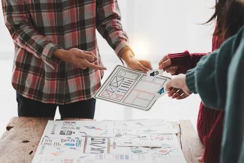 Close up ux developer and ui designer brainstorming interface wireframe design Stock Photos