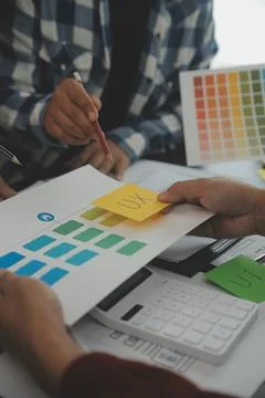 Close up ux developer and ui designer brainstorming about mobile app interf.. Stock Photos