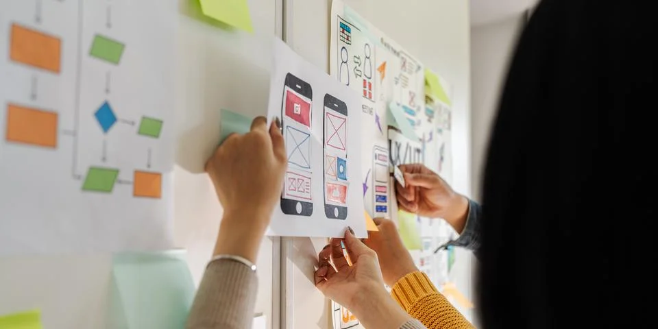 Close up ux developer and ui designer brainstorming interface wireframe design Foto stock