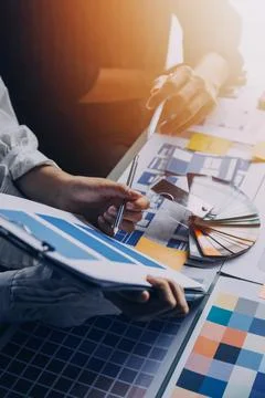 Close up ux developer and ui designer brainstorming about mobile app interf.. Stock Photos