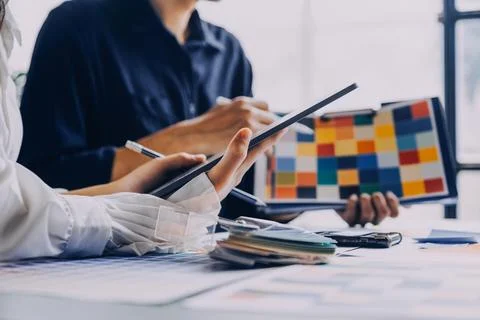 Close up ux developer and ui designer brainstorming about mobile app interf.. Stock Photos