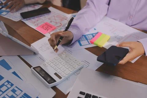 Close up ux developer and ui designer brainstorming about mobile app interf.. 스톡 사진