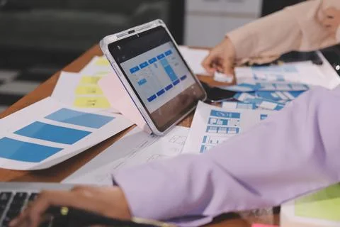 Close up ux developer and ui designer brainstorming about mobile app interf.. Foto stock