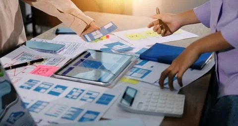 Close up ux developer and ui designer brainstorming about mobile app interf.. 写真素材