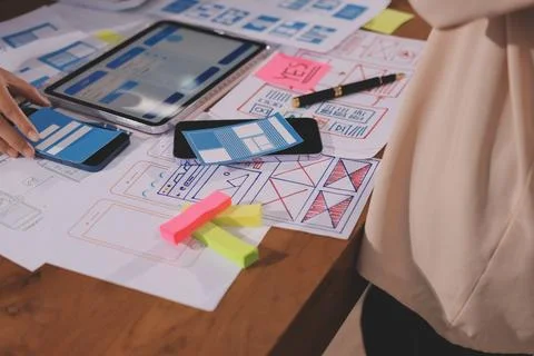 Close up ux developer and ui designer brainstorming about mobile app interf.. 写真素材