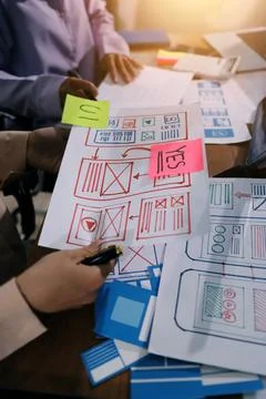 Close up ux developer and ui designer brainstorming about mobile app interf.. Foto stock