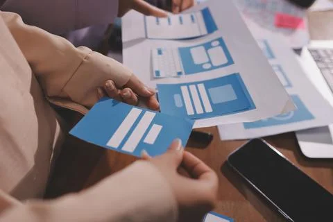 Close up ux developer and ui designer brainstorming about mobile app interf.. 스톡 사진