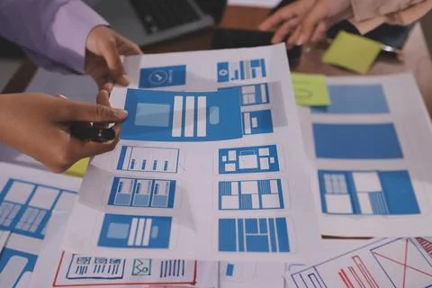 Close up ux developer and ui designer brainstorming about mobile app interf.. Foto stock