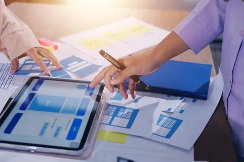 Close up ux developer and ui designer brainstorming about mobile app interf.. Foto stock